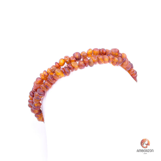 Memory wire bracelet with Baltic raw amber beads - Orange-red raw, unpolished baroque beads