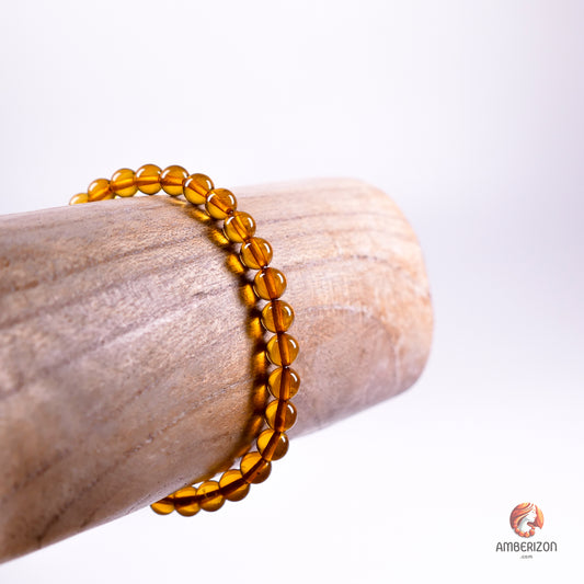 Polished honey amber ball bracelet - Premium AAA quality round beads - Stretchy