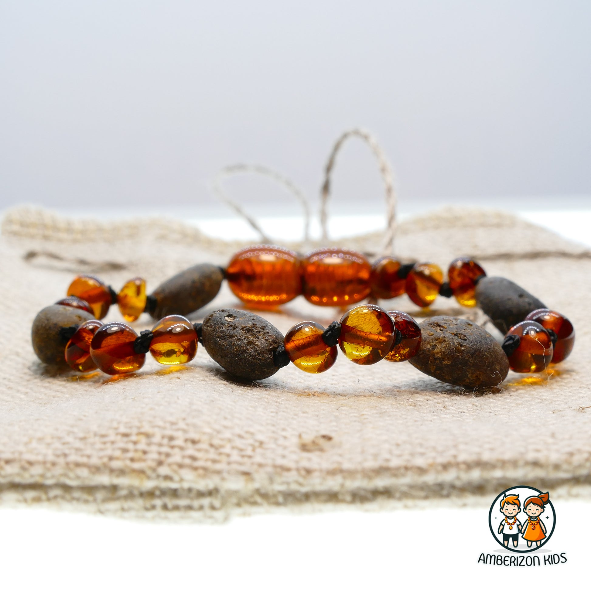Grey & cognac amber baby bracelet-anklet - Polished & frosted bead mix