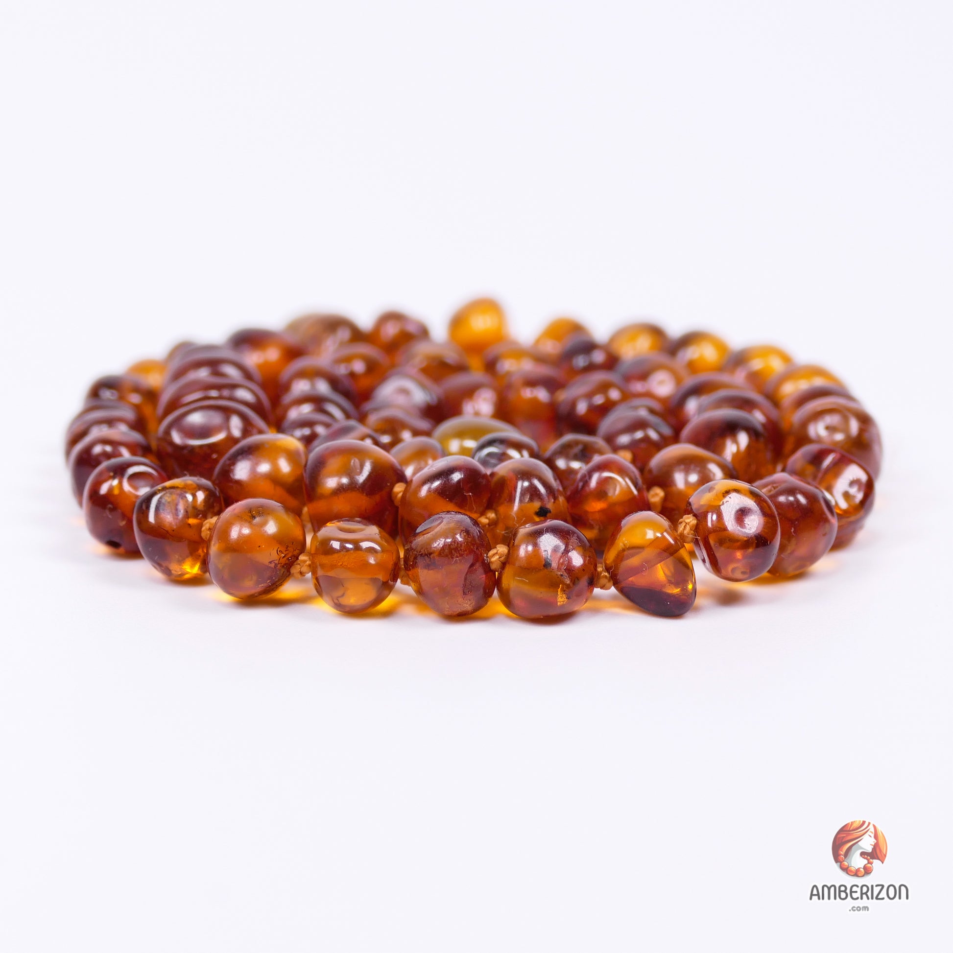 Women's necklace - Clear polished baroque amber beads - Cognac color