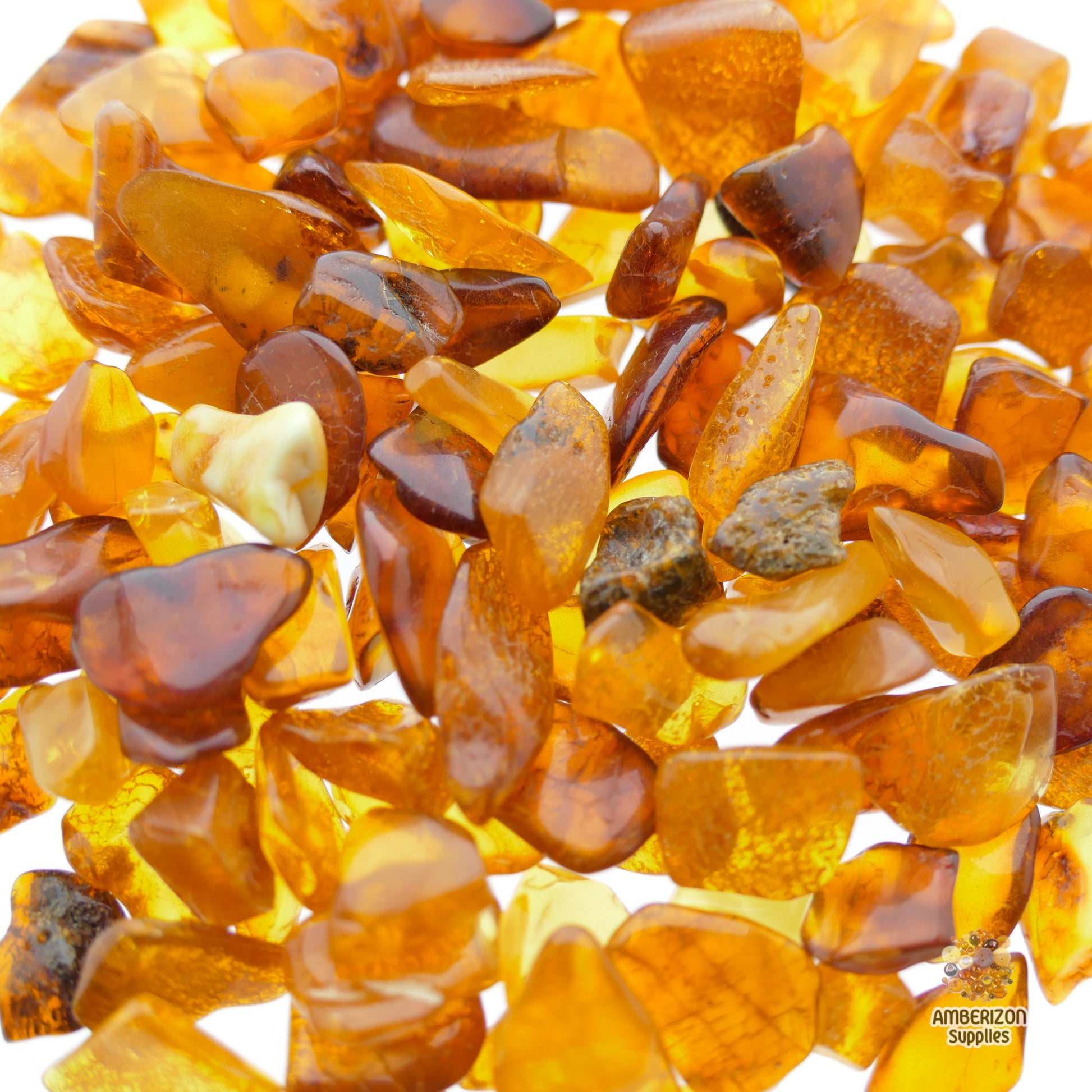 Real loose amber tumbled chips in honey, lemon, cognac, and butterscotch colors for jewelry, crafts, and healing